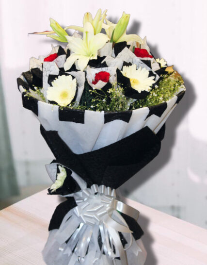 Giftnmore-5 Red Rose and 2 Lily and 5 Gerbera with Black and White Paper Packing